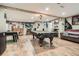 Entertaining basement space with a pool table, foosball table, bar, and lounge area at 5419 Tyree Rd, Winston, GA 30187