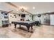 Finished basement featuring a pool table, foosball table, and bar for entertaining at 5419 Tyree Rd, Winston, GA 30187