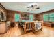 Spacious bedroom with knotty pine walls, hardwood floors, and plenty of natural light from multiple windows at 5419 Tyree Rd, Winston, GA 30187