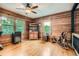 Loft bedroom featuring wood-paneled walls, hardwood floors, and natural light at 5419 Tyree Rd, Winston, GA 30187