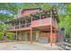 Exterior view of a rustic home with covered porches, stone accents, and ample outdoor space, perfect for relaxing at 5419 Tyree Rd, Winston, GA 30187