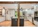 Open concept kitchen with an island, stainless steel appliances, and wood floors at 5419 Tyree Rd, Winston, GA 30187