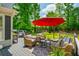 Comfortable outdoor seating and dining arrangement on the spacious back deck, grill included at 7048 Bennington Ln, Cumming, GA 30041