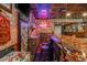 Custom basement bar area with a bottle cap epoxy countertop and brick accents at 7048 Bennington Ln, Cumming, GA 30041