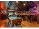 Finished basement featuring a custom bar, pinball machine, and pool table at 7048 Bennington Ln, Cumming, GA 30041