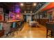 Basement area featuring a custom bar, billiards table, and entertainment space at 7048 Bennington Ln, Cumming, GA 30041