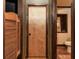 Hallway with rustic wooden saloon doors leading to the bathroom at 7048 Bennington Ln, Cumming, GA 30041