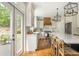 Charming kitchen featuring white cabinets, stainless steel appliances, and a center island with seating at 7048 Bennington Ln, Cumming, GA 30041