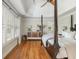 Main bedroom with hardwood floors, plantation shutters, tray ceiling, and lots of natural light at 7048 Bennington Ln, Cumming, GA 30041