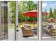 Outdoor patio featuring comfortable seating, a cozy rug, and a view of the spacious backyard at 7048 Bennington Ln, Cumming, GA 30041