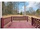 Inviting back deck with lattice railing, perfect for enjoying the expansive wooded backyard at 1031 Bettina Sw Ct, Mableton, GA 30126
