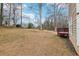 Lush backyard featuring mature trees and a well-maintained lawn, perfect for relaxation and recreation at 1031 Bettina Sw Ct, Mableton, GA 30126
