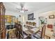 Traditional dining room featuring a large dining table with seating for eight and decorative screen at 1031 Bettina Sw Ct, Mableton, GA 30126