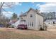 Charming two-story home with a well-manicured lawn, mature trees, and a spacious back deck at 1031 Bettina Sw Ct, Mableton, GA 30126