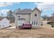 Well-maintained home with a spacious backyard, featuring a deck and mature trees at 1031 Bettina Sw Ct, Mableton, GA 30126
