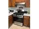 Updated kitchen with stainless steel range and hood, white countertops, and wooden cabinets at 1031 Bettina Sw Ct, Mableton, GA 30126