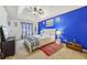 Stylish main bedroom with tray ceiling, ceiling fan, and ample natural light at 1031 Bettina Sw Ct, Mableton, GA 30126