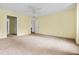 Spacious bedroom with neutral carpet, ceiling fan, and two entryways at 1229 Colony Cir, Marietta, GA 30068