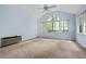 Bedroom with high ceiling, large windows, and a ceiling fan at 1229 Colony Cir, Marietta, GA 30068