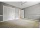 Bedroom featuring a closet with bifold doors, carpeted floors, and chair rail at 1229 Colony Cir, Marietta, GA 30068