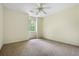 Bedroom with neutral walls, a ceiling fan, and a window providing natural light at 1229 Colony Cir, Marietta, GA 30068