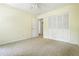Well-lit bedroom featuring neutral carpet and a spacious closet, offering a calming and comfortable atmosphere at 1229 Colony Cir, Marietta, GA 30068