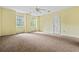Bedroom with large windows overlooking the landscape and a ceiling fan at 1229 Colony Cir, Marietta, GA 30068