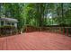 Spacious wooden deck surrounded by lush greenery, perfect for outdoor relaxation and entertaining at 1229 Colony Cir, Marietta, GA 30068