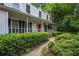 Charming home with a covered front porch and lush landscaping, offering an inviting curb appeal at 1229 Colony Cir, Marietta, GA 30068