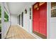 Inviting front porch with a striking red door and classic black shutters, offering curb appeal at 1229 Colony Cir, Marietta, GA 30068