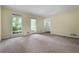 Bright and spacious room with large windows, neutral carpeting and an open doorway at 1229 Colony Cir, Marietta, GA 30068