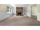 Cozy room featuring a brick fireplace, built-in shelves, and access to another room at 1229 Colony Cir, Marietta, GA 30068