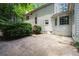 Concrete patio area adjoining the home, offering space for outdoor seating and activities at 1229 Colony Cir, Marietta, GA 30068