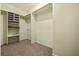 Walk-in closet with built-in shelving and rod for hanging clothes at 1229 Colony Cir, Marietta, GA 30068