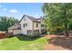 The house has a backyard with green grass and some patio furniture at 2265 Venture Dr, Marietta, GA 30062