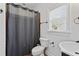 Traditional bathroom featuring a tiled shower with a curtain, a toilet, and a vanity at 2265 Venture Dr, Marietta, GA 30062