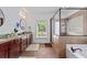 Bathroom featuring double sinks, granite countertops, and separate shower and tub at 2265 Venture Dr, Marietta, GA 30062