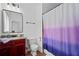 Functional bathroom with granite vanity, a toilet and bathtub with shower curtain at 2265 Venture Dr, Marietta, GA 30062