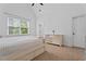 Bright bedroom with vaulted ceilings, large window, and pastel-colored dresser at 2265 Venture Dr, Marietta, GA 30062