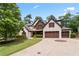 Charming home with stone accents, complemented by a well-manicured lawn and a spacious driveway at 2265 Venture Dr, Marietta, GA 30062