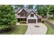 Beautiful house exterior with a lawn, brown shutters, and a two-car garage at 2265 Venture Dr, Marietta, GA 30062
