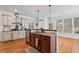 Modern kitchen island with granite countertop, stainless steel appliances, and hardwood floors at 2265 Venture Dr, Marietta, GA 30062