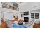Spacious living room featuring a fireplace, built-in shelving, and hardwood floors at 2265 Venture Dr, Marietta, GA 30062