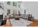 Open-concept living room with tall ceilings, fireplace and large windows at 2265 Venture Dr, Marietta, GA 30062