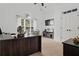 Well-lit home office featuring a vaulted ceiling, modern decor, and a cozy fireplace at 2265 Venture Dr, Marietta, GA 30062