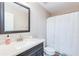 Modern bathroom with a large mirror, modern vanity, and a shower with tub at 314 Meadows Ln, Canton, GA 30114