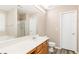 Bright bathroom featuring a large mirror, modern vanity, and a separate tub and shower at 314 Meadows Ln, Canton, GA 30114