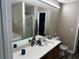 Spacious bathroom featuring large vanity, shower/tub combo, and wood-look flooring at 314 Meadows Ln, Canton, GA 30114