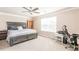 Spacious bedroom with large windows, ceiling fan, and plush carpeting at 314 Meadows Ln, Canton, GA 30114
