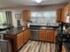 Kitchen featuring stainless steel dishwasher and black countertops at 314 Meadows Ln, Canton, GA 30114
